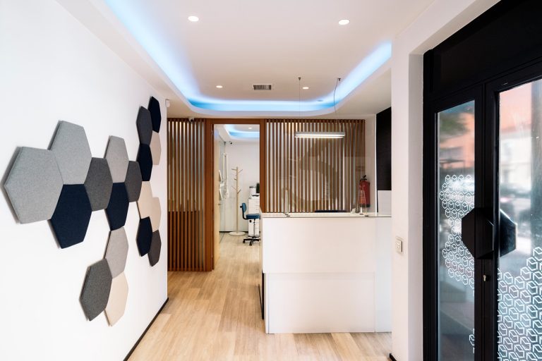 Modern special-shaped acoustic panels in a dental clinic.